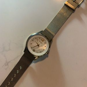 Gold watch with pearl face